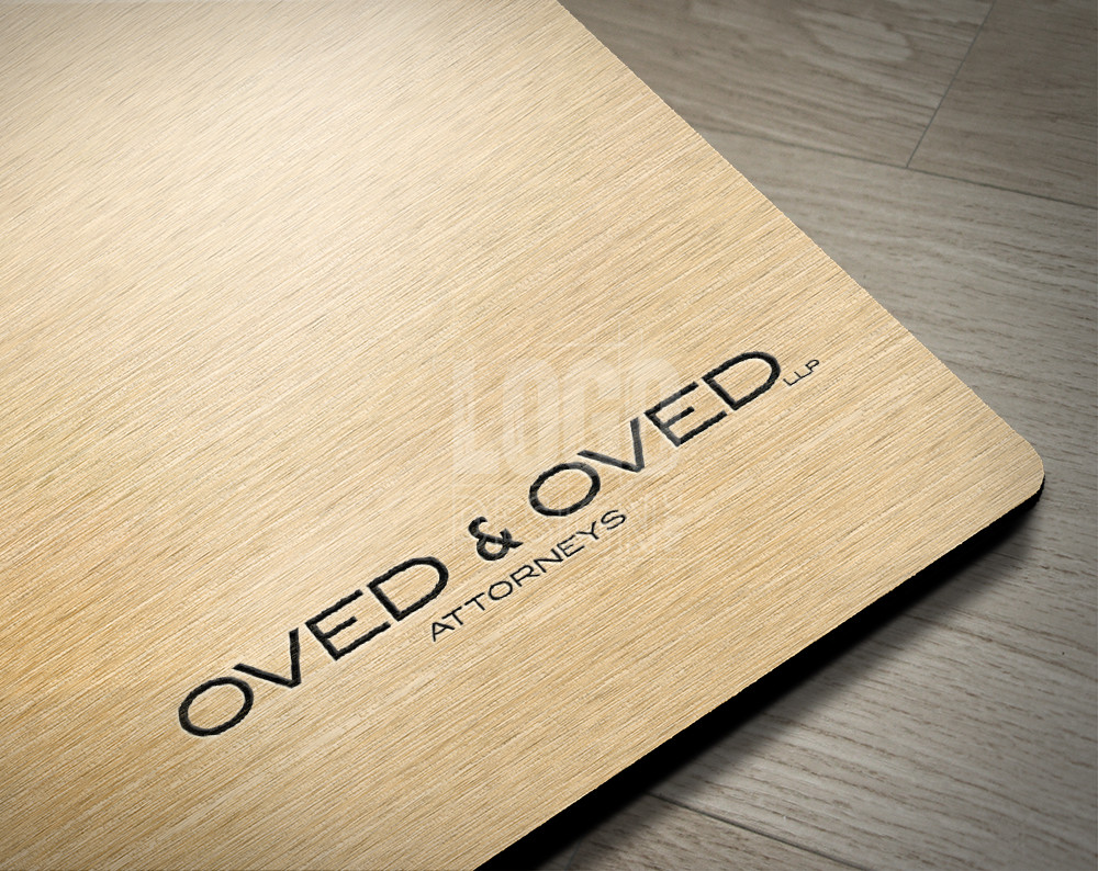 law firm logo design displayed on wood