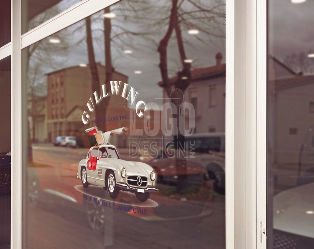 car dealership logo design displayed on a window