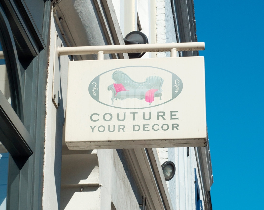 furniture store logo design displayed on a store sign