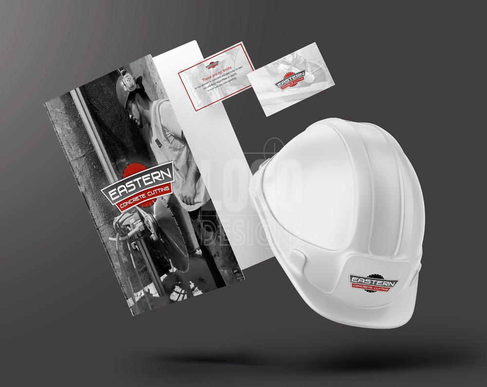 construction logo design displayed on booklet, business cards, and hard hat