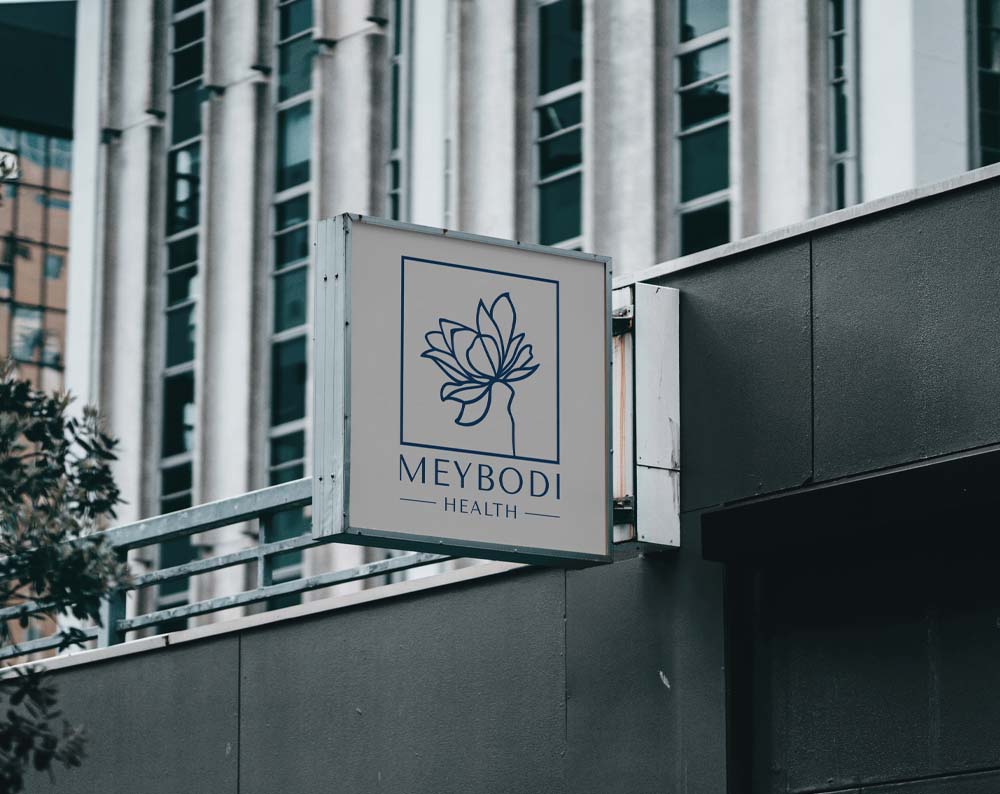 healthcare logo design displayed on a store sign