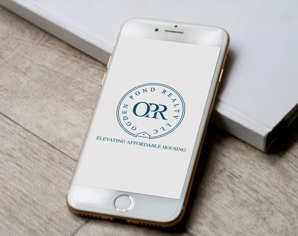 real estate logo design displayed on a cell phone screen