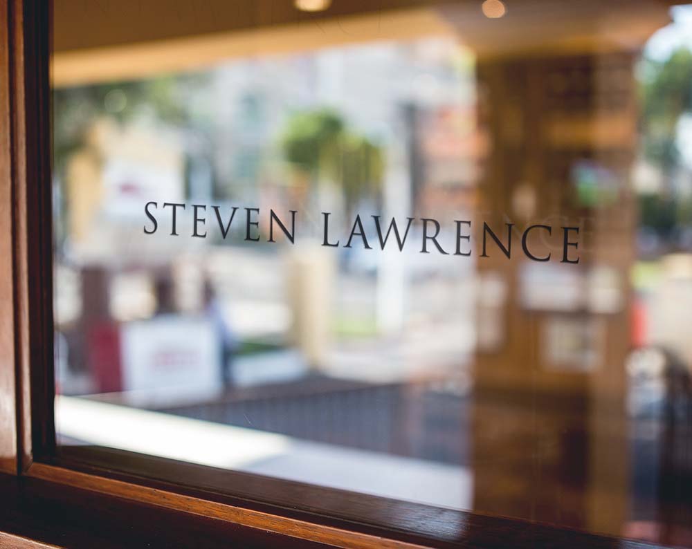 jewelry store logo design displayed on a window