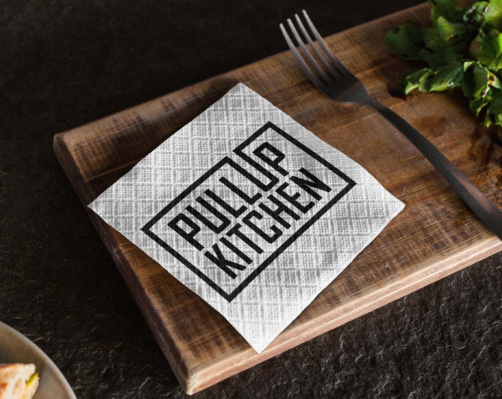 food and beverage logo design displayed on a napkin