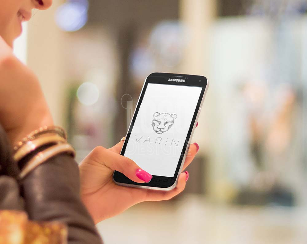 Beauty product logo design displayed on cell phone screen