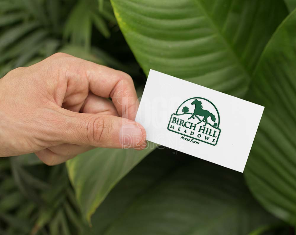 Farm logo design displayed on a business card