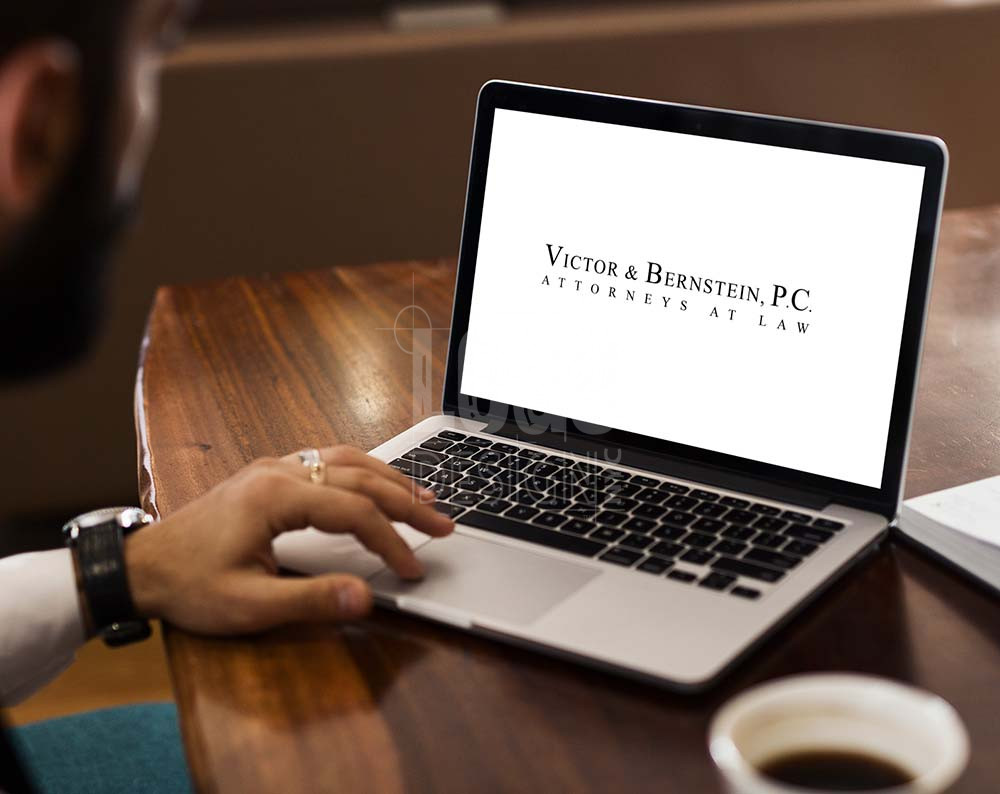 Law firm logo design displayed on a lap top