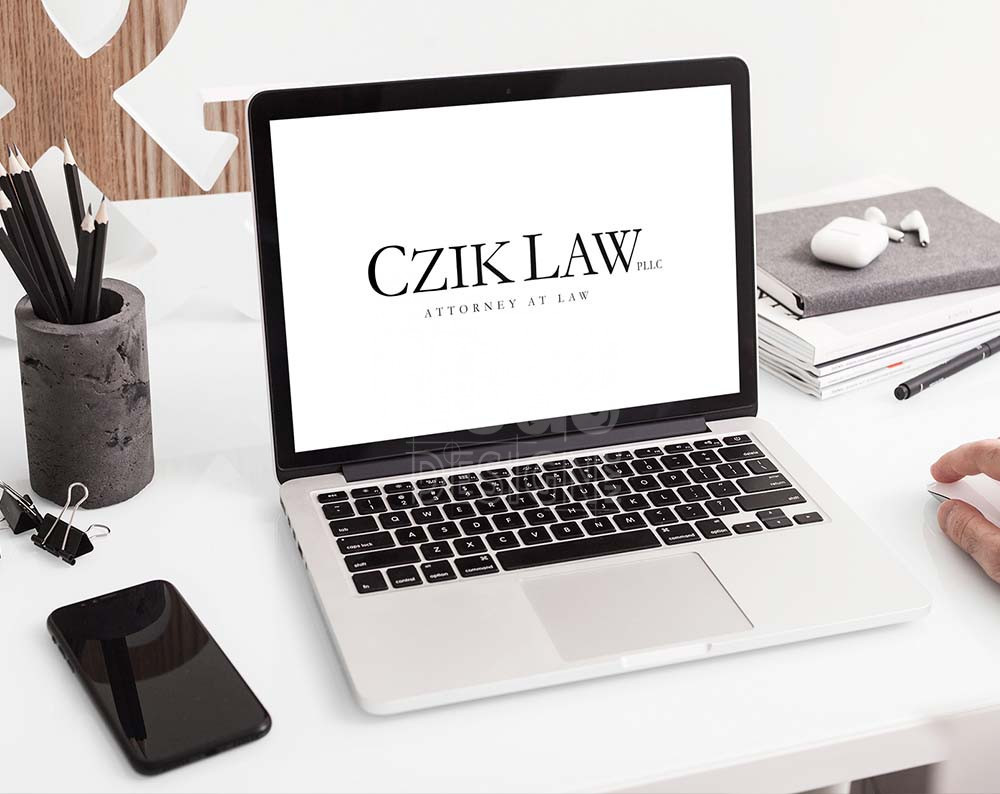 Law firm logo design displayed on a lap top screen