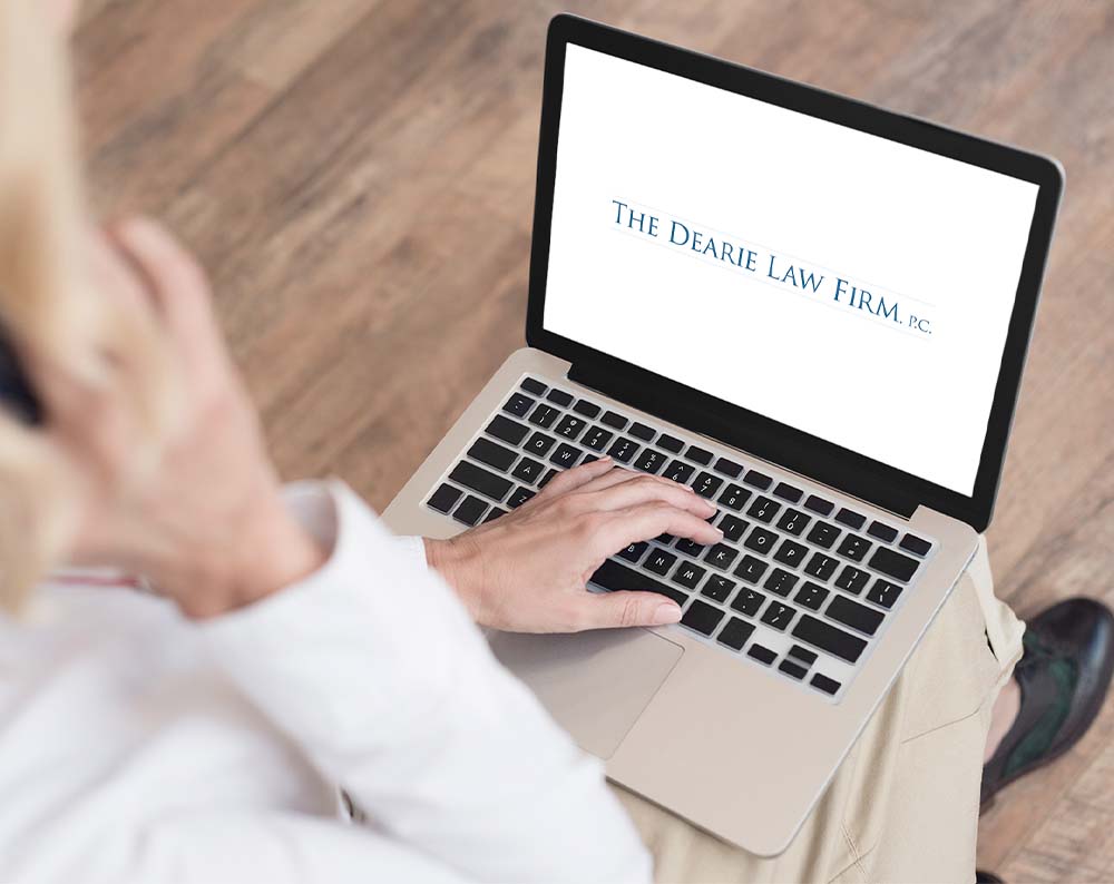 Law firm logo design displayed on a lap top screen