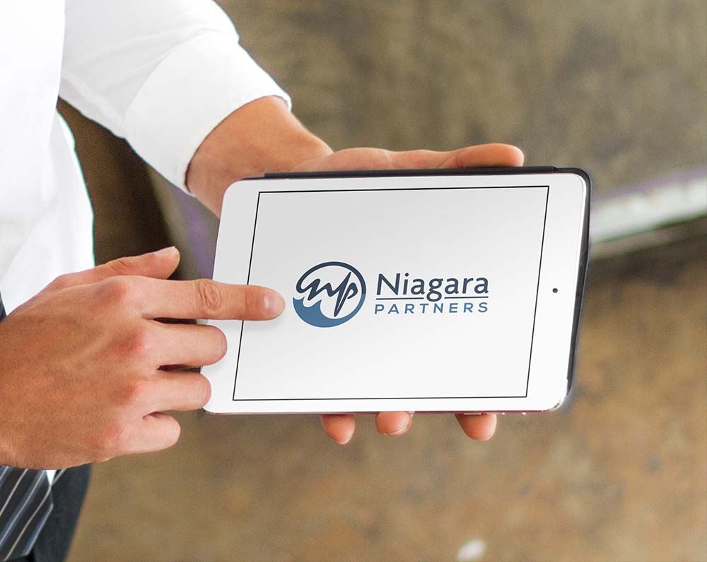 Corporate logo design displayed on a tablet screen