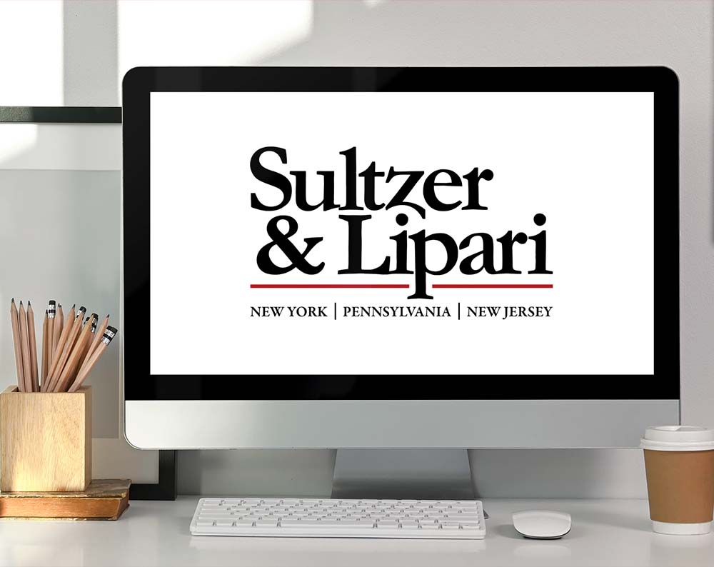 Law firm logo design displayed on a desk top screen