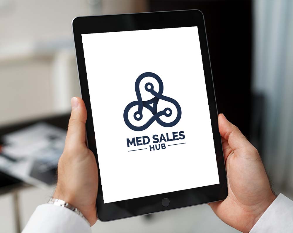 Medical logo design displayed on a tablet screen