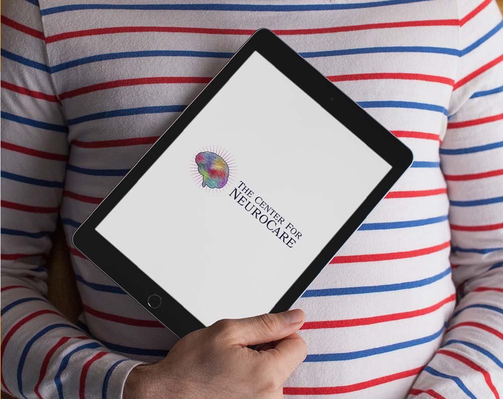 Medical logo design displayed on a tablet screen