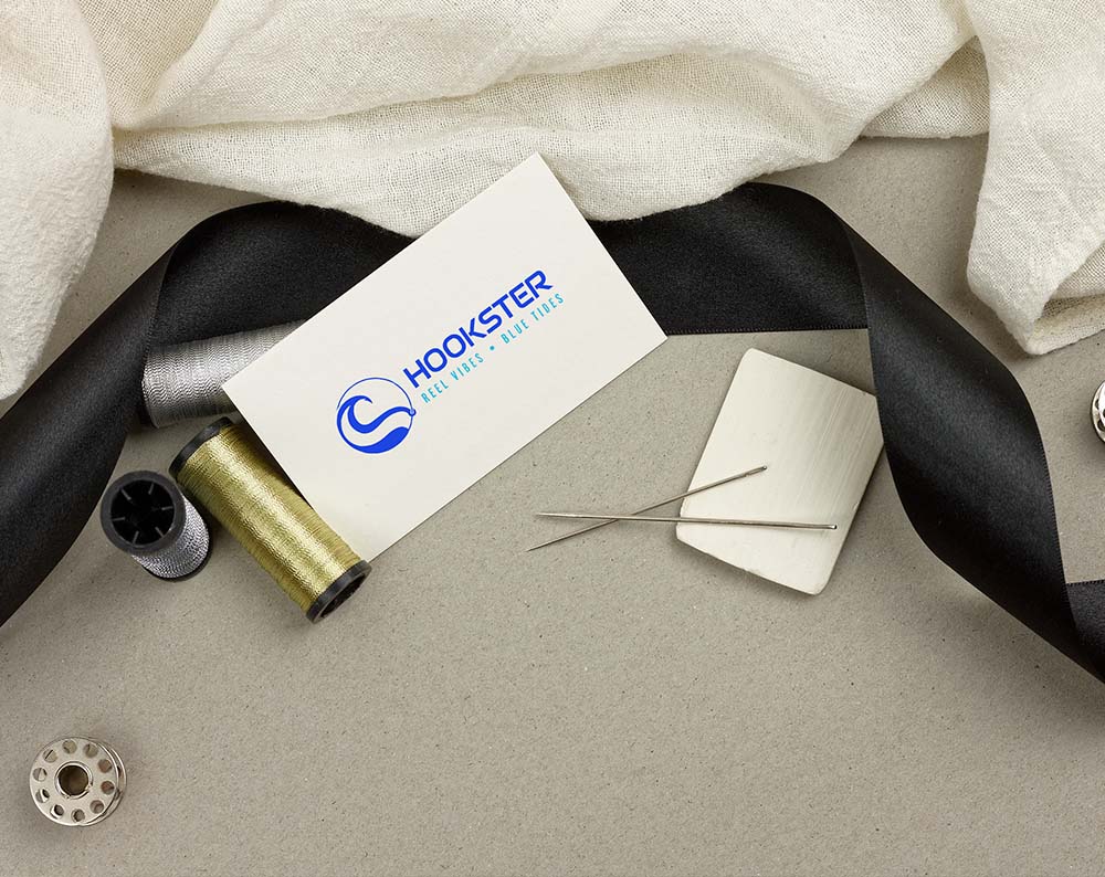 logo for clothing company displayed om buisness card