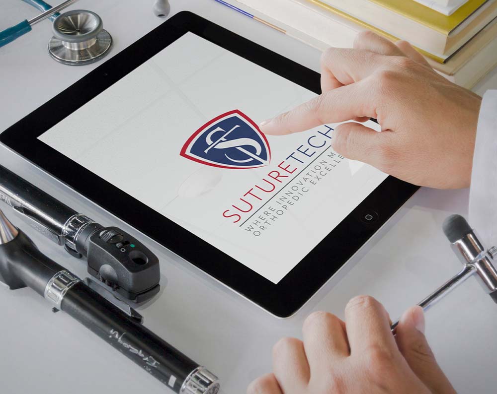 logo for medical care company displayed on tablet