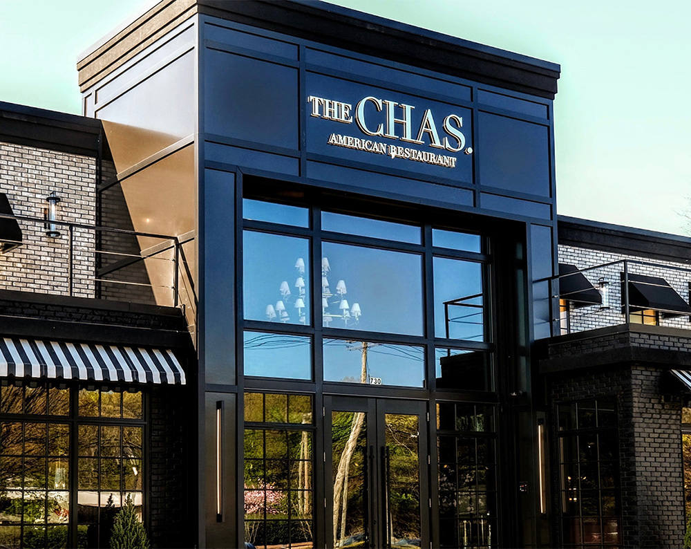 Exterior signage of the Chas restaurant location
